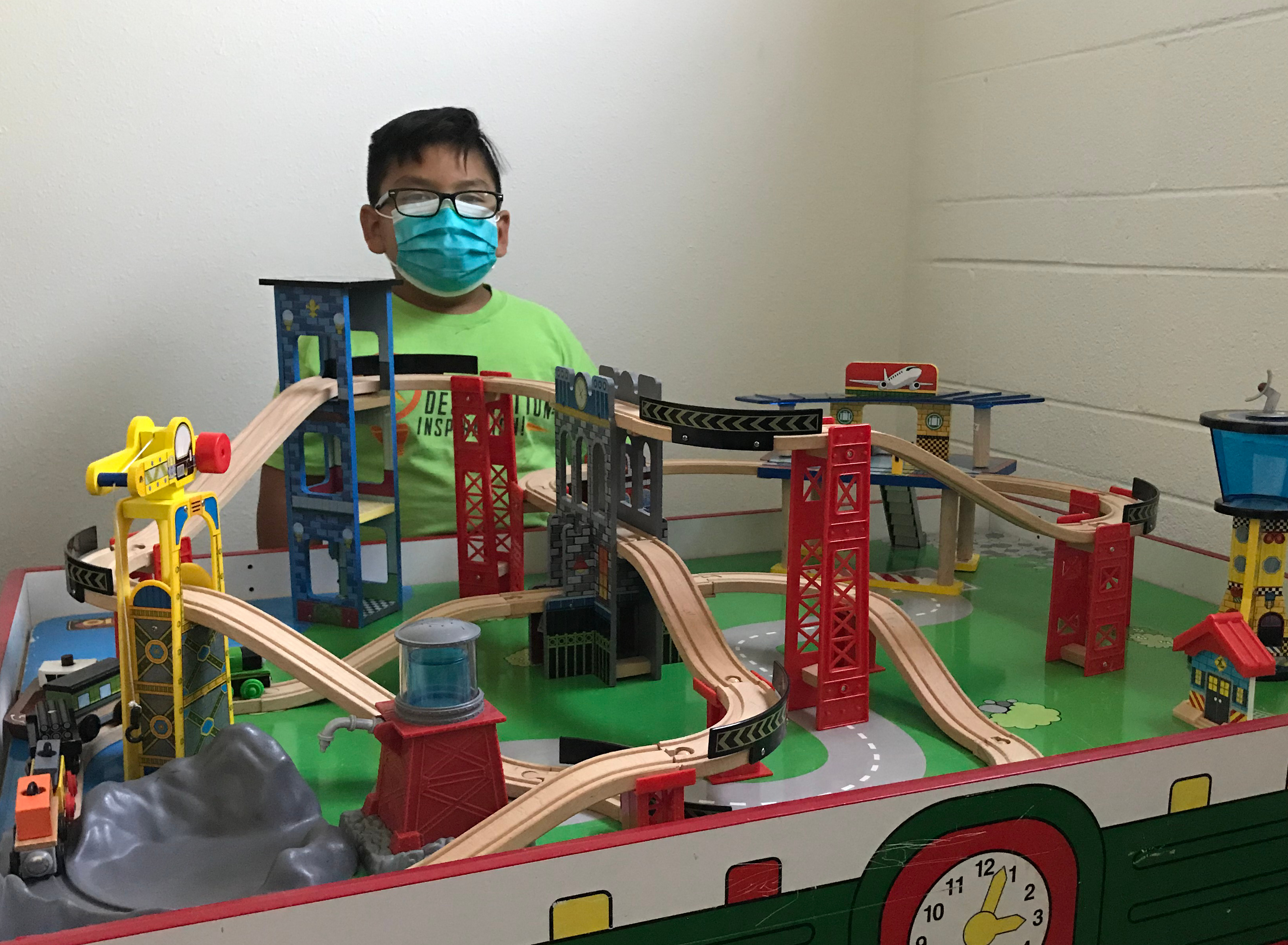 boy at motor skill train set
